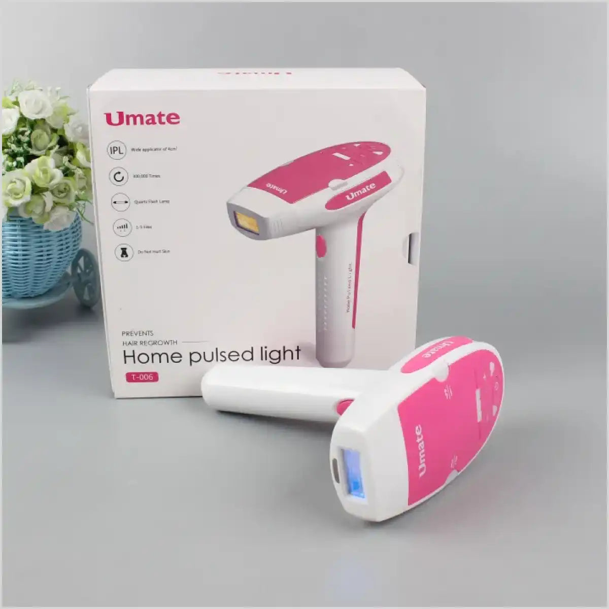 Umate home pulsed light (HPL) hair removal device in pink and white, displayed with its packaging box featuring product details and specifications.